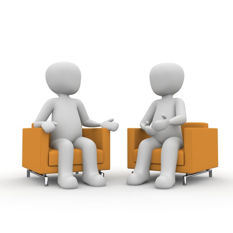 Foto: Zwei 3-D-Männchen im Beratungsgespräch.